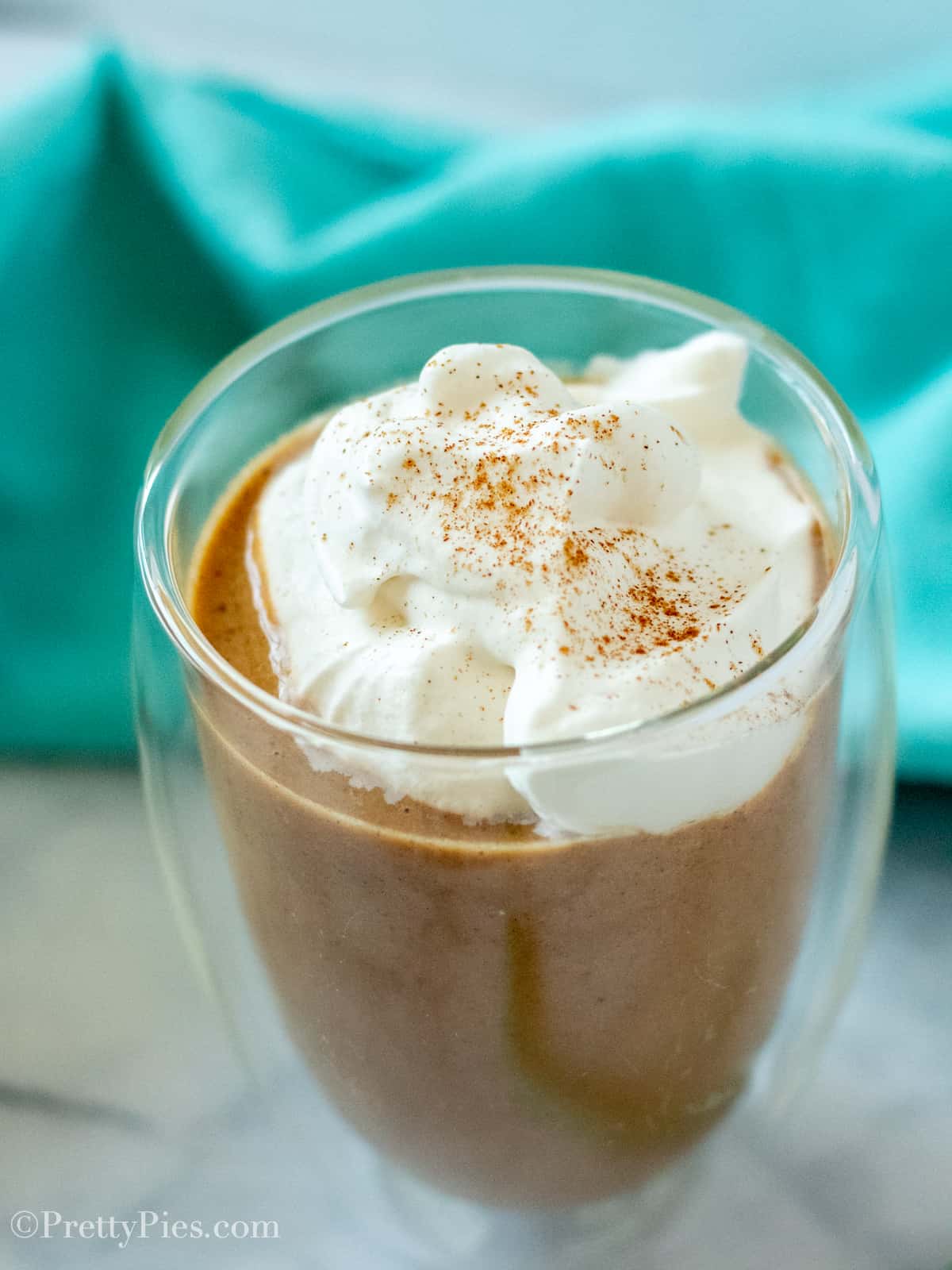Clear glass with Low-Carb Dairy-Free Pumpkin Spice Frap with whipped cream