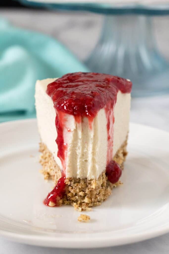 Low-Carb Dairy-Free Classic Cheesecake slice with strawberry sauce