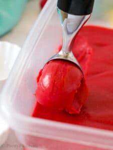 scooping raspberry sorbet