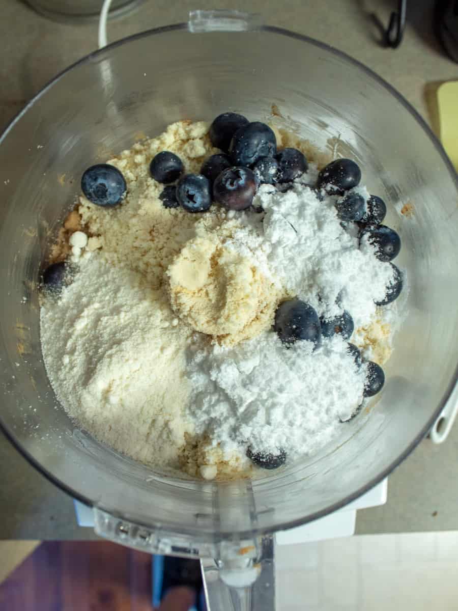 food processor overhead view with raw ingredients 