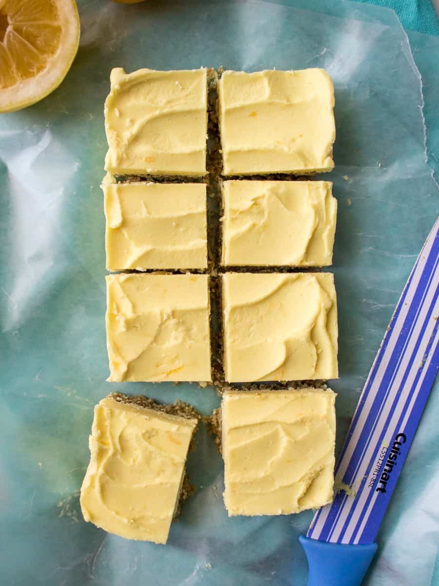 overhead view of lemon cheesecake cut into squares